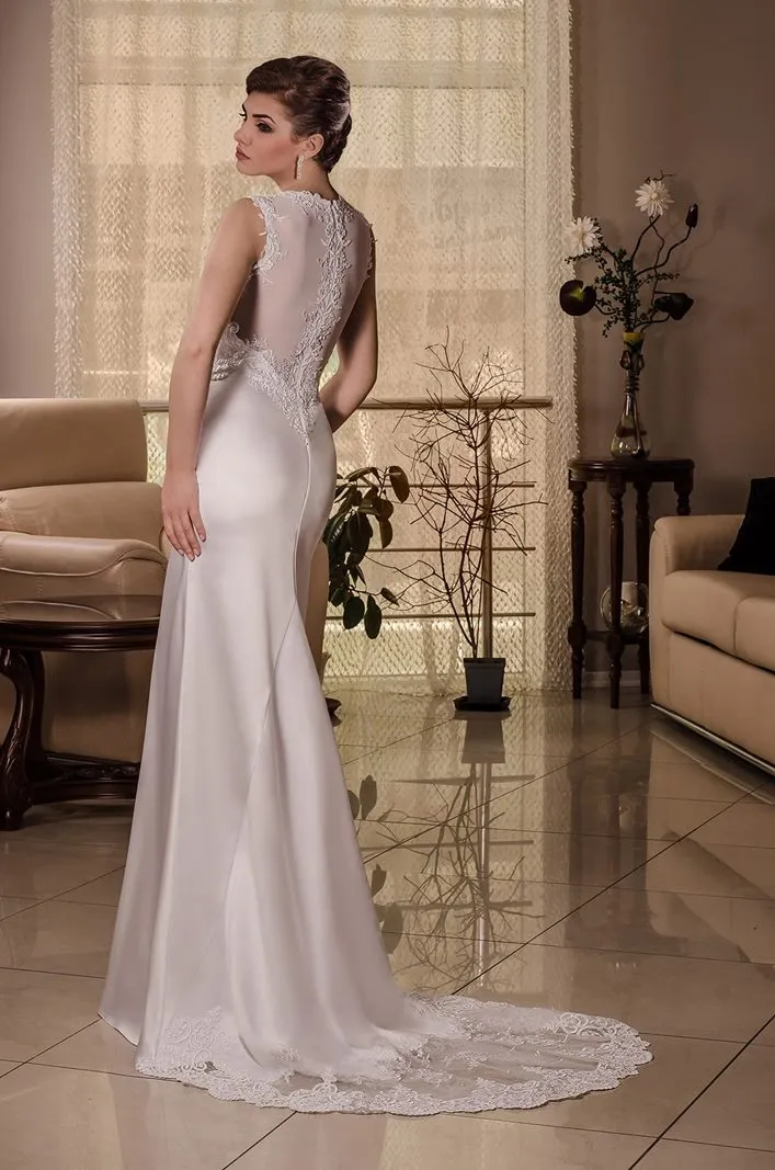 ---Romantic and sensual wedding dress made of silk satin with lace and beading applications--